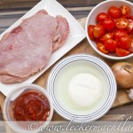 Gratinierte Putensteaks auf Tomatensugo